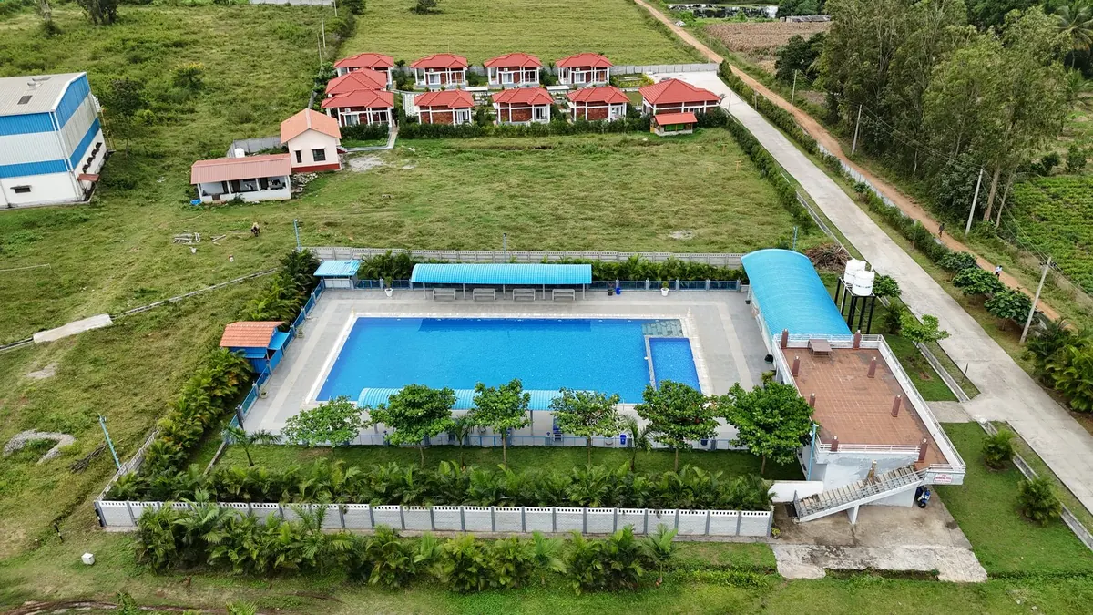 The FTCI cottages and swimming pool seen from the air