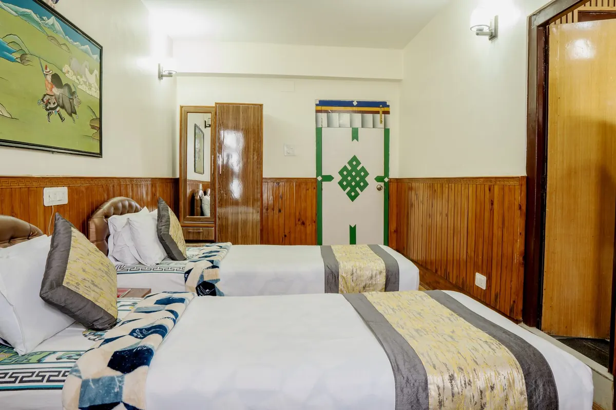Twin beds in a Deluxe Room at Hotel Tibet Gangtok